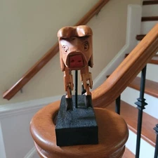 Folk Art Carved Pig Dangling Legs on Metal Stake Dark Stain Block Base 