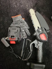 Hand Held 6 Inch Chainsaw. One Battery, Gloves, Glasses. New