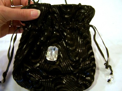 black drawstring evening bag