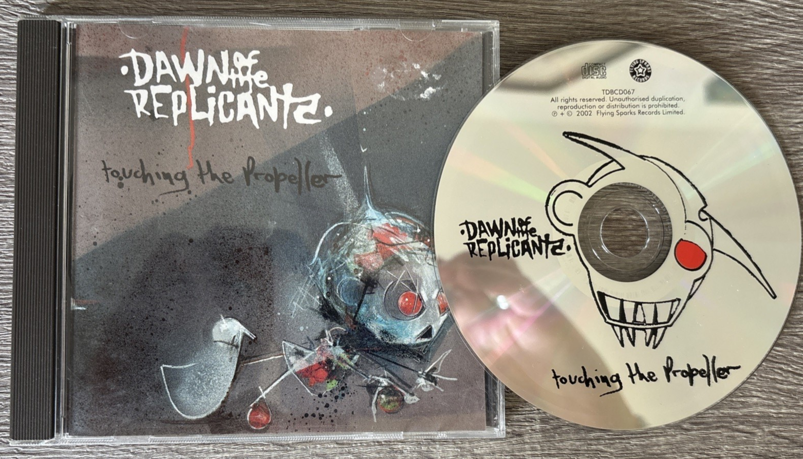 Dawn Of The Replicants - Touching The Propeller : CD Album 2002