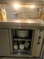 professional kitchen present hot table with hot drawers 