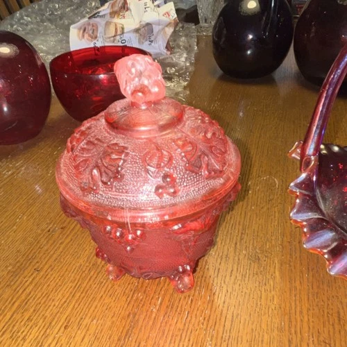 Red Carnival Glass Decorative Basket with Ruffled Edge and Handle and candy dish