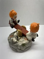 Vintage Wind Up Musical Raggedy Ann & Andy on See Saw Figurine Music Box