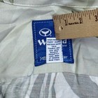 Vintage blue and white striped Wyland shirt with yellow fish rayon label, white fabric, and “Made in U.S.A.” text.
