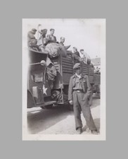 WW2 Photo U.S. Military Vehicle Loaded With Civilians Man Standing Next To Truck