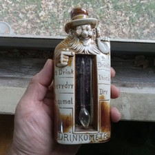 1915 ERA SCHAFER & VATER DRINKOMETER CERAMIC BEARDED MAN FLASK ORIGINAL LABEL