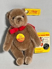 Vintage Steiff Bear color is Caramel with red ribbon about 5 tall 0202/14