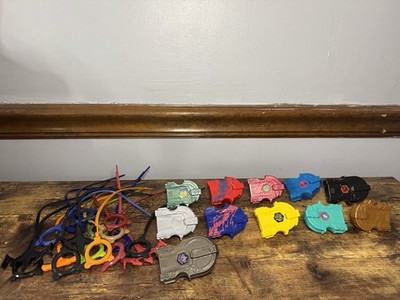 Lot Of Beyblade 11 Launchers & 17 Rip Cord Zip Strings 