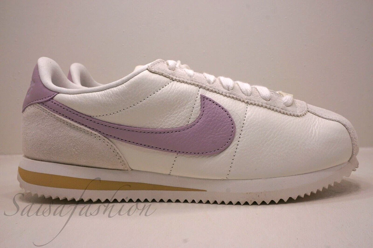 Nike cortez club gold sale
