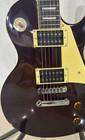 A bright electric guitar with a light yellow protective cover. Fast shipping.