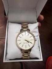 Nine West Women's Crystal Accented Gold-Tone Bracelet Watch