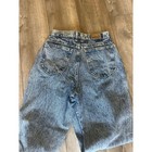 Back view of 90s vintage Lee High Rise Mom Jeans in blue distressed denim with two pockets and visible Lee logo on waistband.