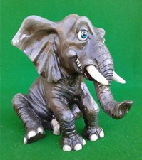 ARORA COMICAL SEATED ELEPHANT.