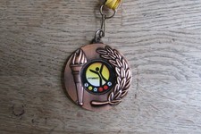 Médaille des vainqueurs MSC avec flamme olympique