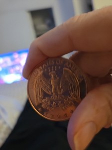 Copper Round With The American Flag On It Its Got The American Eagle On The Back
