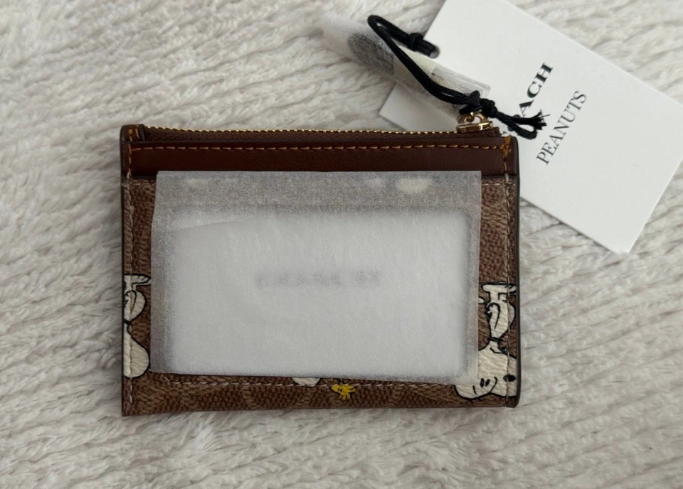 Muñequera Coach X Peanuts con cremallera en esquina en lona exclusiva con estampado Snoopy Foto 2 de 3