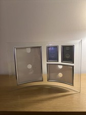 curved glass photo frame designed to hold multiple photographs