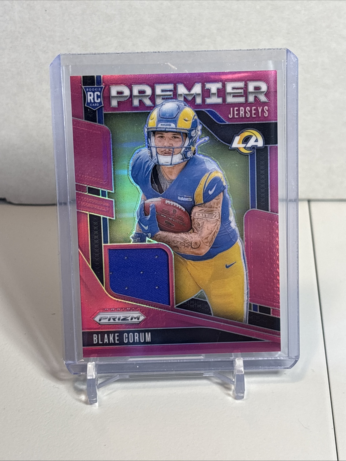 2024 Panini Prizm - Premier Jerseys Pink Prizm #PJ-BCM Blake Corum (MEM, RC)