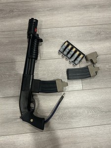 Tokyo Marui how airsoft breacher shotgun with m4 mag adapter, tracer, and shells