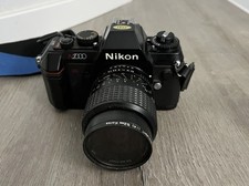 Nikon N2000 SLR Film Camera w/Minolta 125mm Zoom/Ozunon 52mm Lenses. Untested