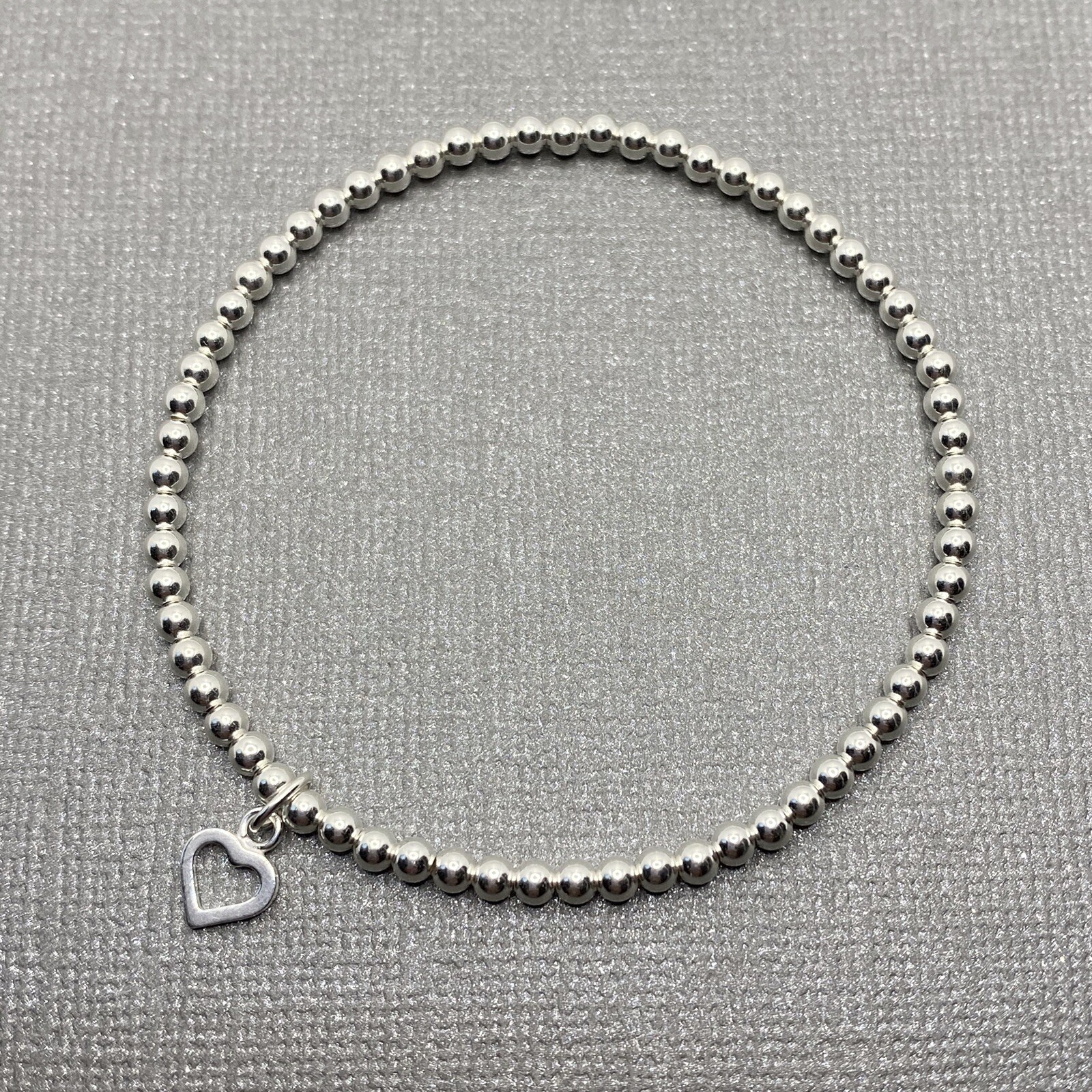 Sterling Silver Stretch Beaded Bracelet With Heart Charm. Handmade