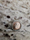 1952 silver dime that is toned.