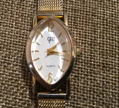VG II Diamond Shape Raised Crystal White Face Textured Gold Tone Band Watch 8 In