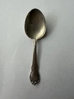 A Lunt Sterling silver spoon, likely from the "Modern Victorian" series.