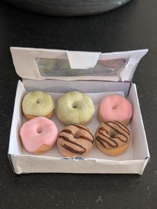 mini clay donut mini books and dobut box if you buy everthing it will be 4.06$