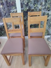 4 Solid Oak Dining Chairs in good condition with New seat pads.Free local del.