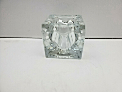 Clear cube shaped candlestick with a heart shape embossed on the sides