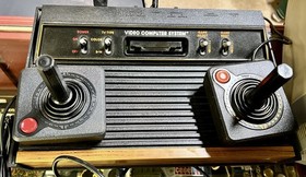 VINTAGE ATARI 2600 GAME SYSTEM w/ 2 CONTROLLERS JOYSTICKS & PADDLES TESTED WORKS