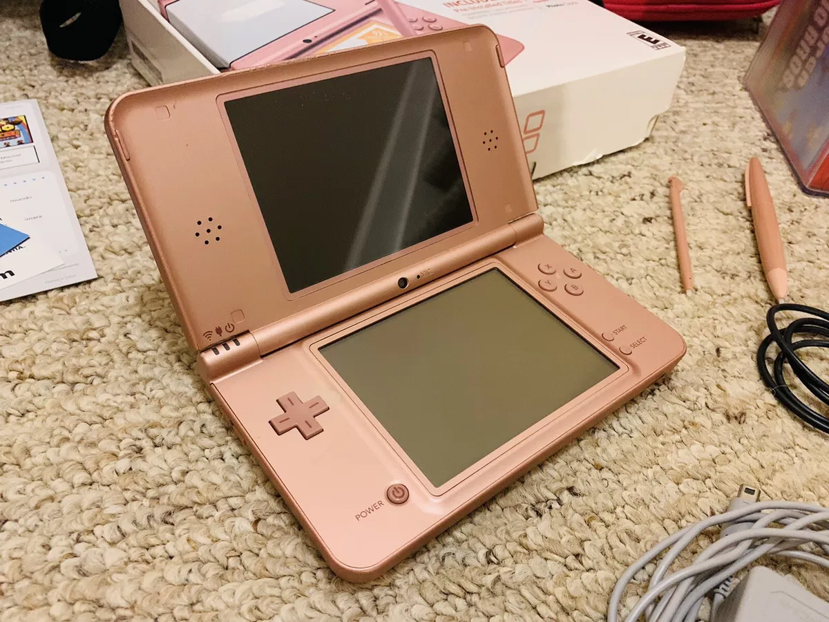 Nintendo DSi XL with original games, charger and case 