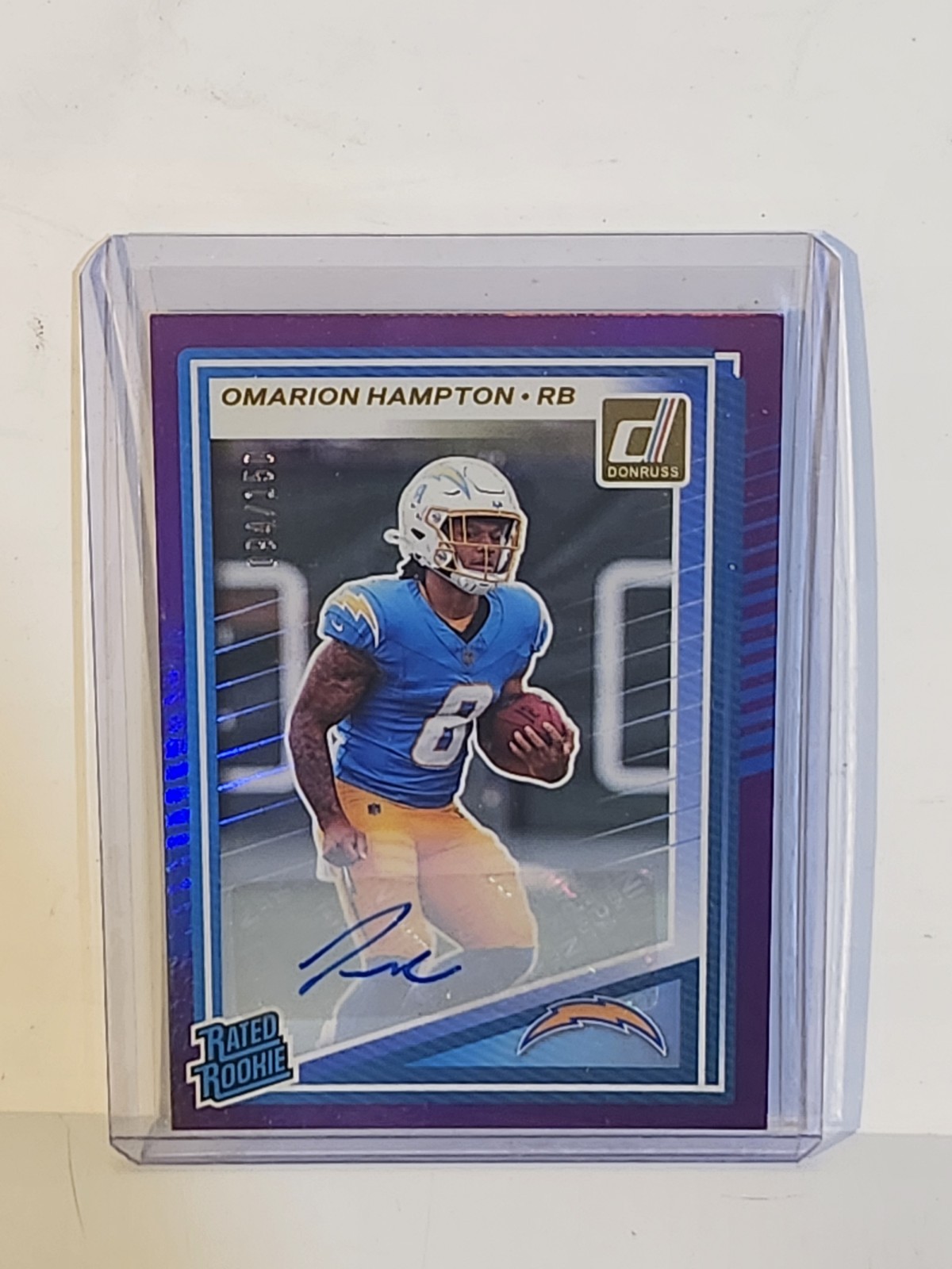 2025 Panini Donruss - Rated Rookie Omarion Hampton #303 Purple Auto 94/150