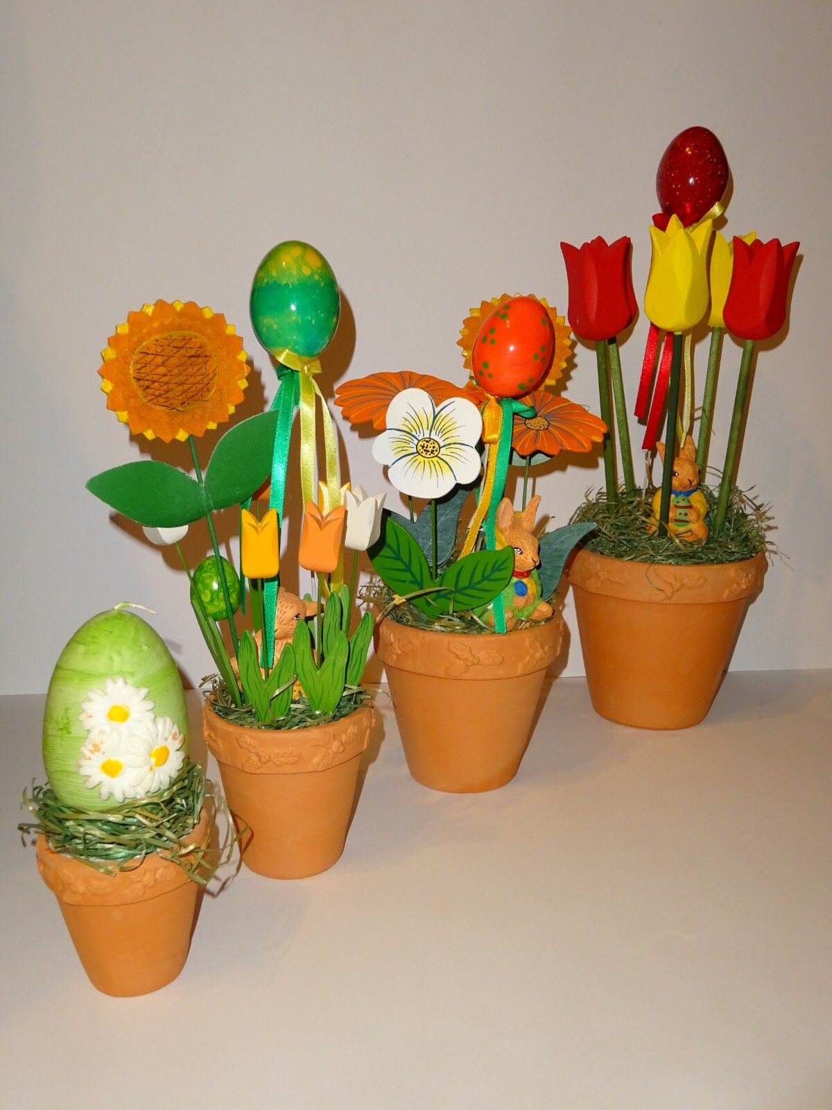 4er Set Ostergesteck Blumentopf Blumen Holz Osterhase Kerze Osterdekoration