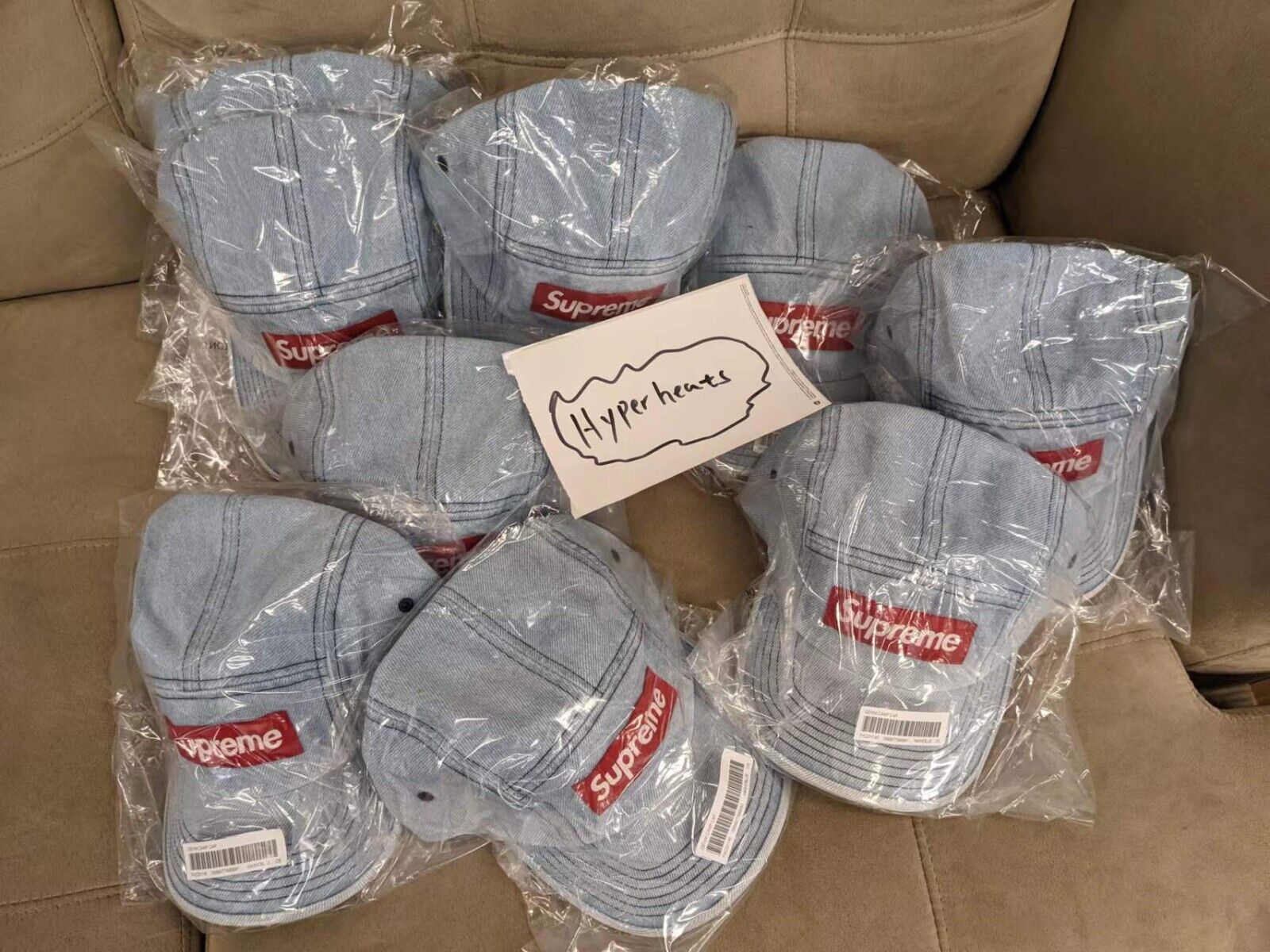 FW22 SUPREME DENIM CAMP CAP WASHED BLUE RED BOX LOGO IN HAND