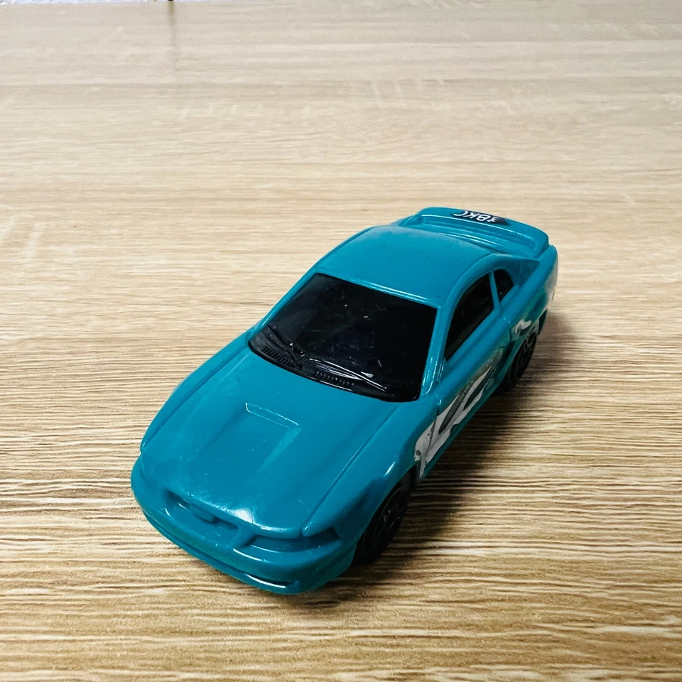 Литая модель автомобиля BKC Irwin Toy 2000 Teal Flames Ford Mustang масштаб 1:64 - Изображение 2 из 4