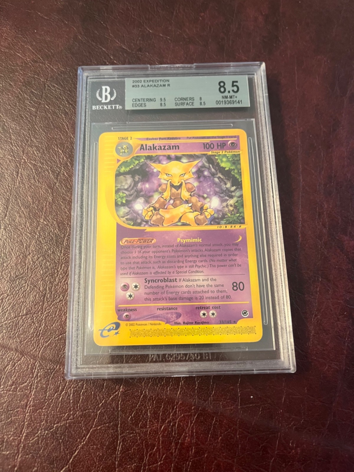 Alakazam Pokemon (2002) Expedition - 33/165 Beckett 8.5 NM-MT+