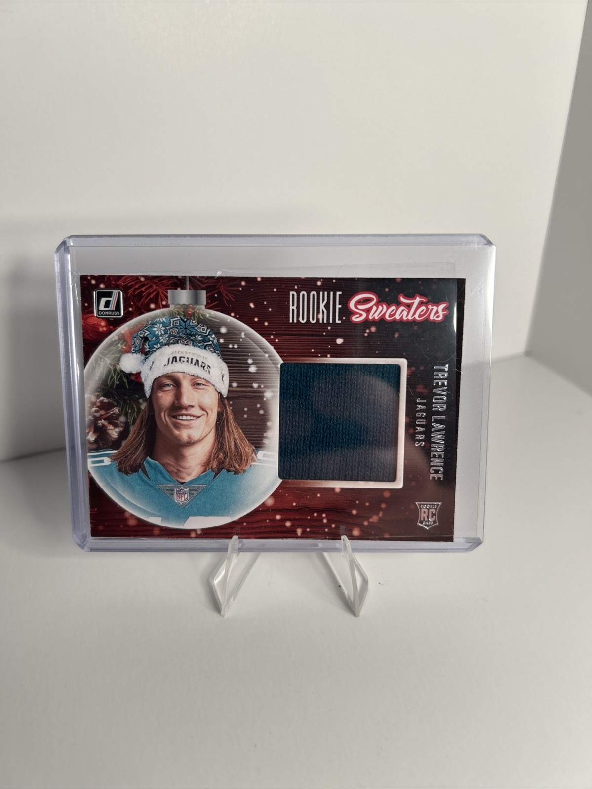 Trevor Lawrence Panini Donruss Rookie Holiday Sweater Memorabilia #RSTRL Base