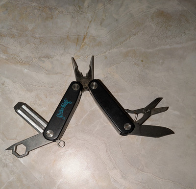 Black STRIKE KING Multi-Tool with Pliers File Scissors & More