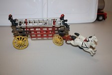 Cast Iron Horse Drawn Hook and Ladder, with 2 ladders and 2 firemen.