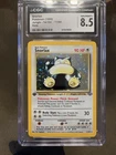 1999 Pokémon TCG Jungle Snorlax Holo 1st Edition CGC 8.5 11/64 Card Stock