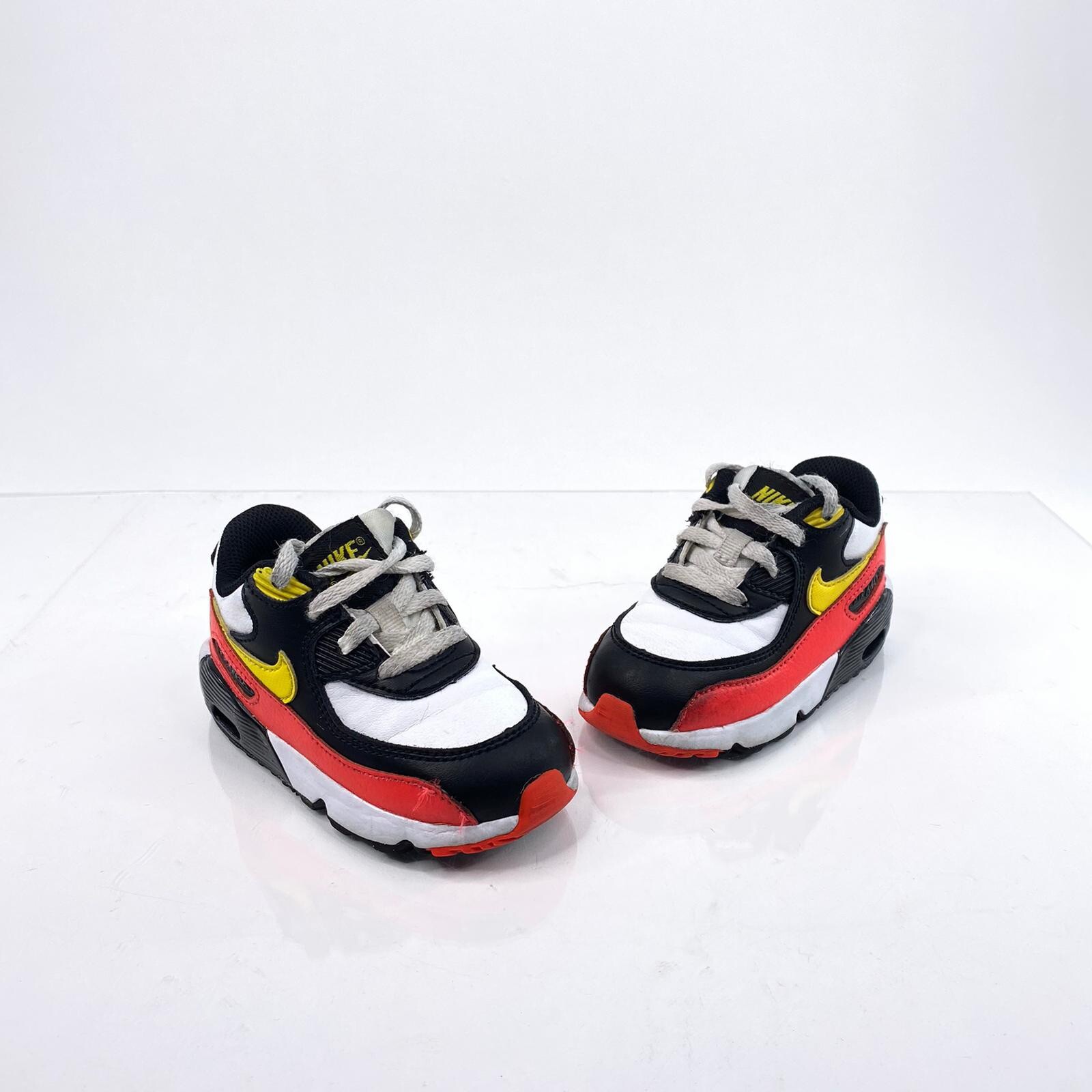 black and yellow nike toddler shoes