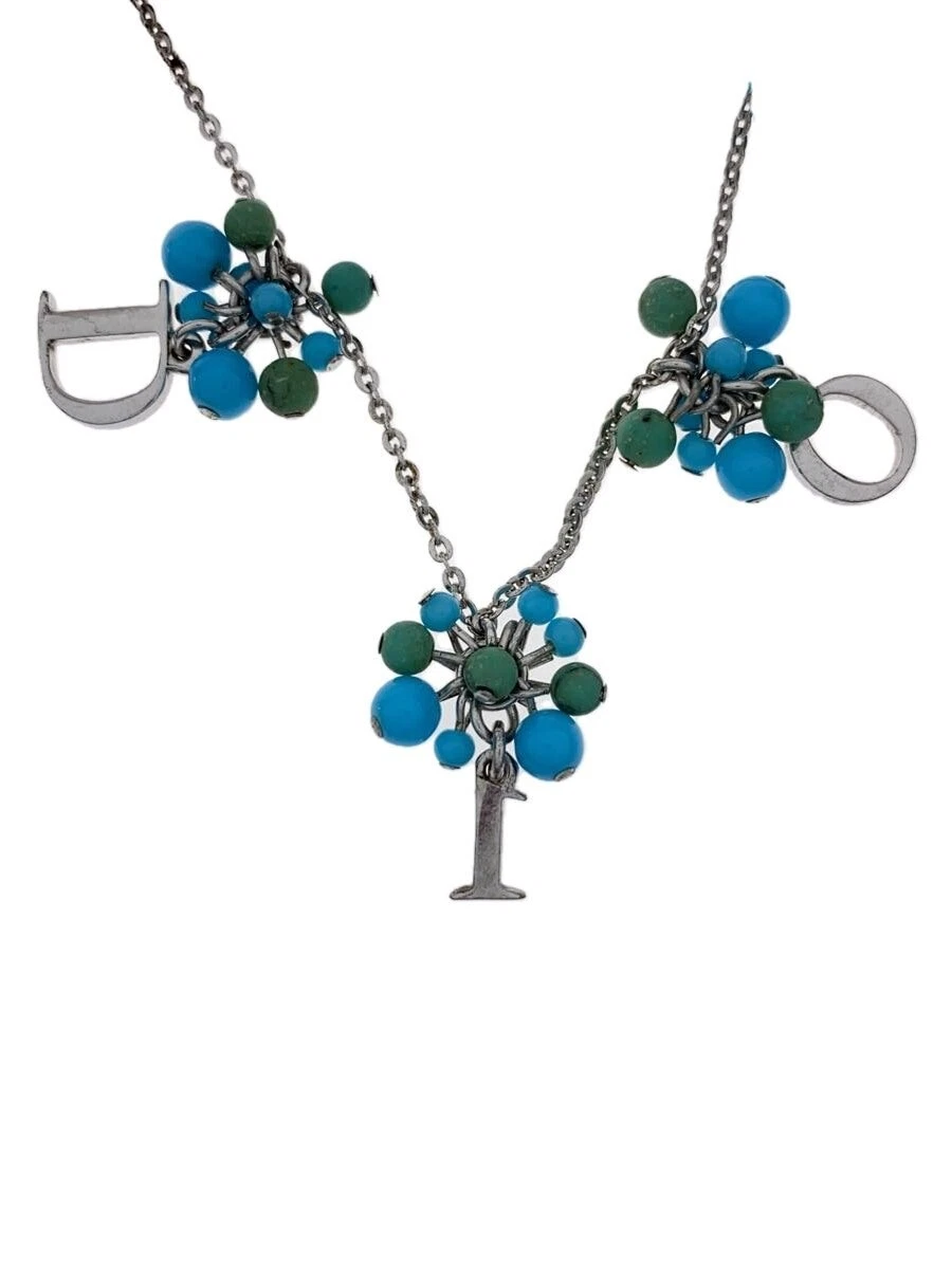 Collier Christian Dior    Haut avec femme