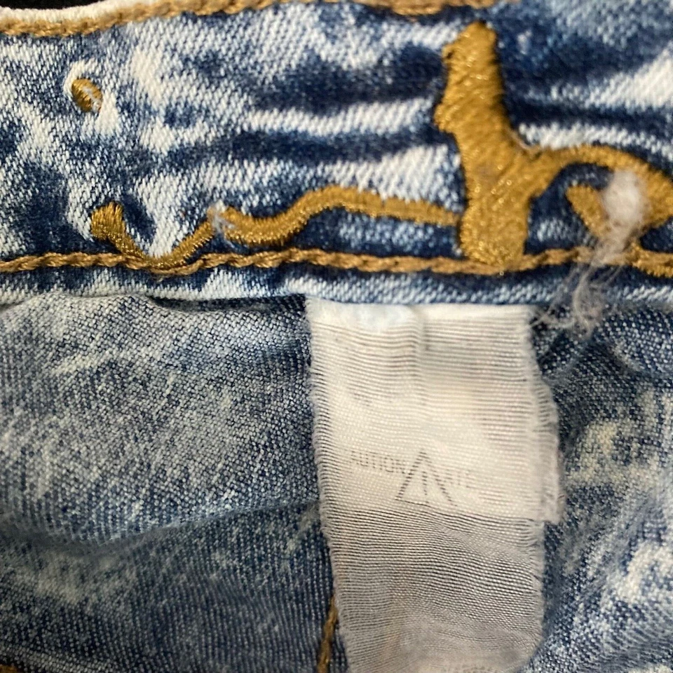 Pantalones de mezclilla elásticos vintage de mezclilla azul lavado con ácido para mujer 31 detalles con flecos Foto 3 de 4