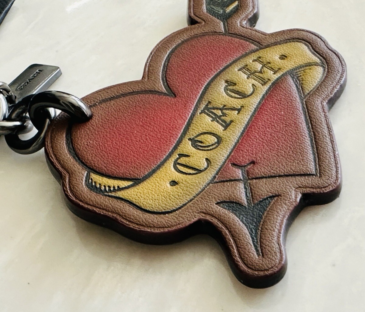 COACH TATTOO HEART & ARROW LEATHER BAG CHARM SADDLE/MULIT