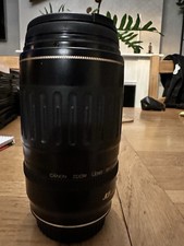 Canon EF 70-210mm f/3.5-4.5 USM telephoto zoom lens + Canon ET-65 II lens+hood.