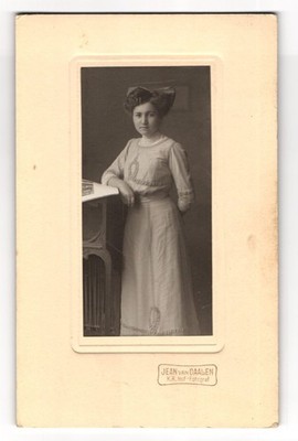 Photograph Jean van Daalen, Pretty young woman in white dress with bow 