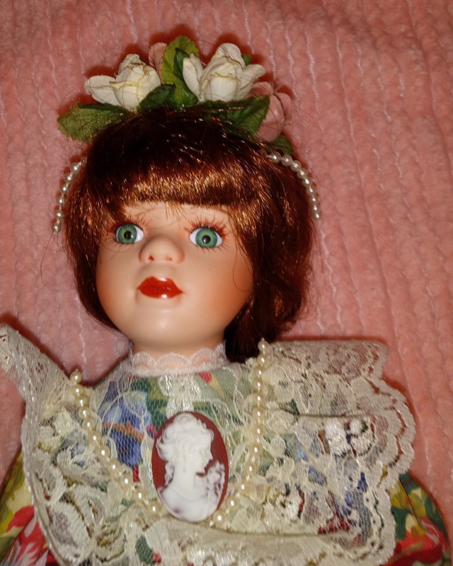 Vintage porcelain soft expressions DOLL has tag flower Dress and cameo brooch