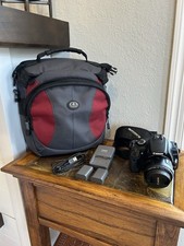 Canon EOS Rebel XTi Digital SLR Camera Bundle w/2 Batteries, Backpack DS126151